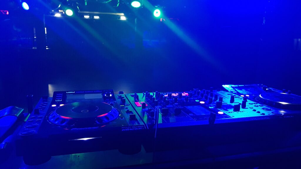 DJ booth at the night club, neon lights